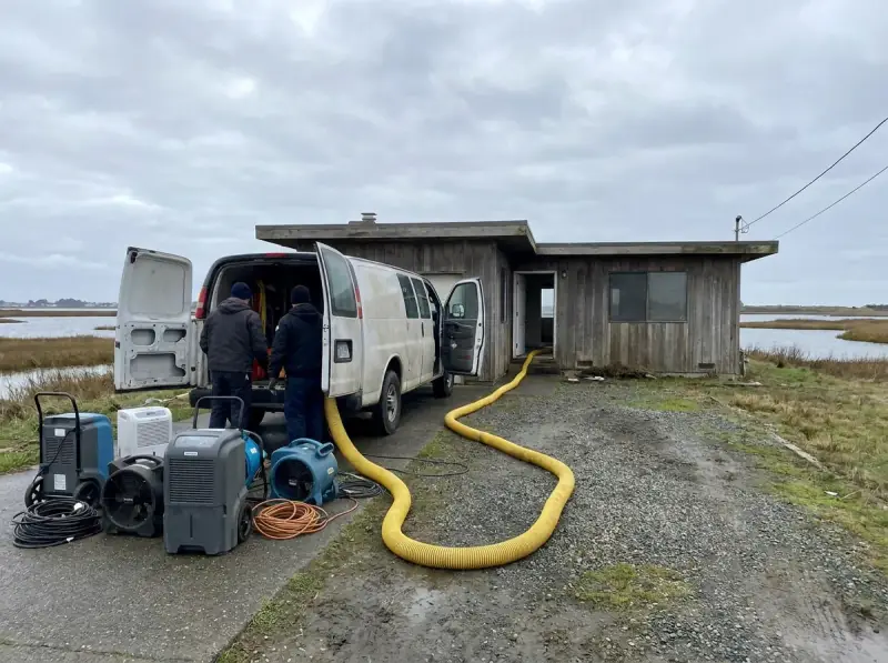 Restoration van staged with extraction hose run to the property in Foster City, California