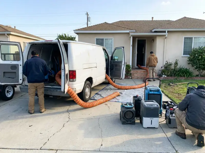 Restoration van staged with extraction hose run to the property in Santa Clara, California