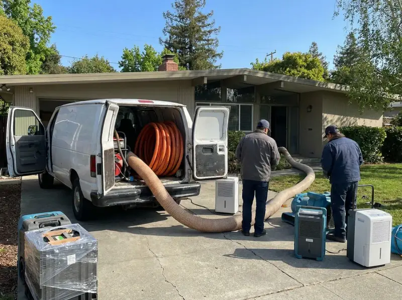 Restoration van staged with extraction hose run to the property in Sunnyvale, California